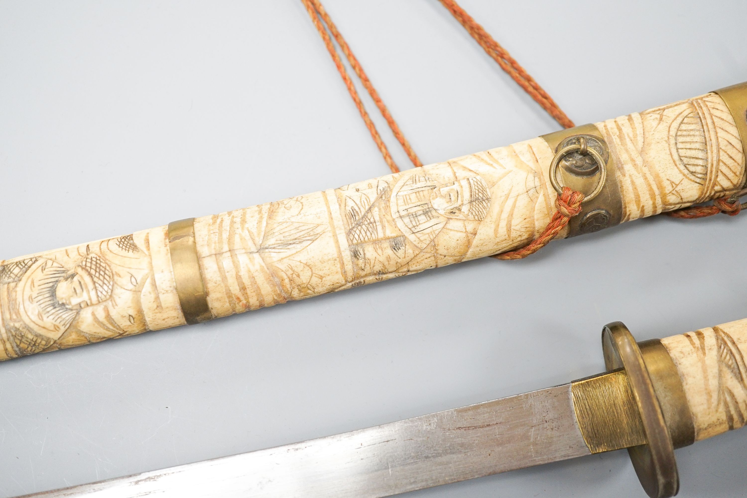 A 20th century bone and brass mounted tanto sword